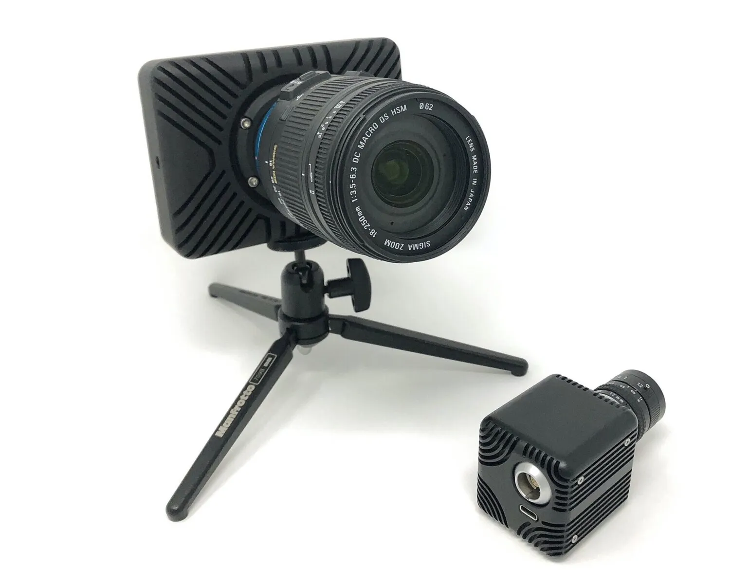Two HSCAM camera housing form factors together, studio photograph.